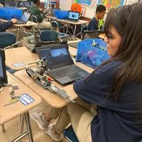 A student and her Lego creation