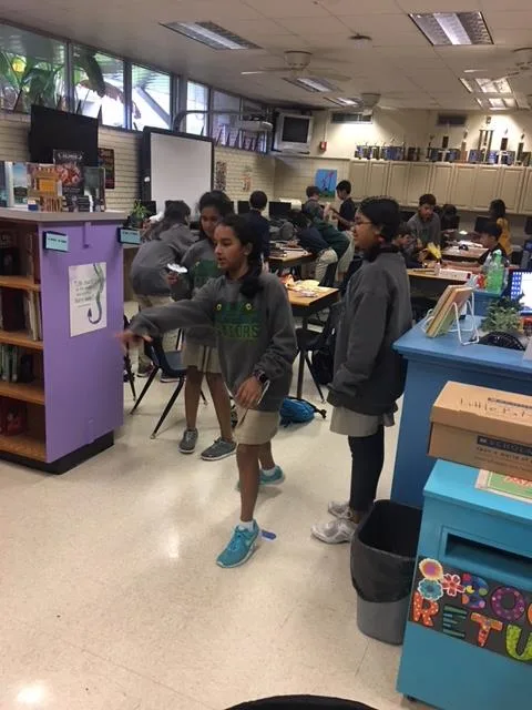 Three female students playing a game